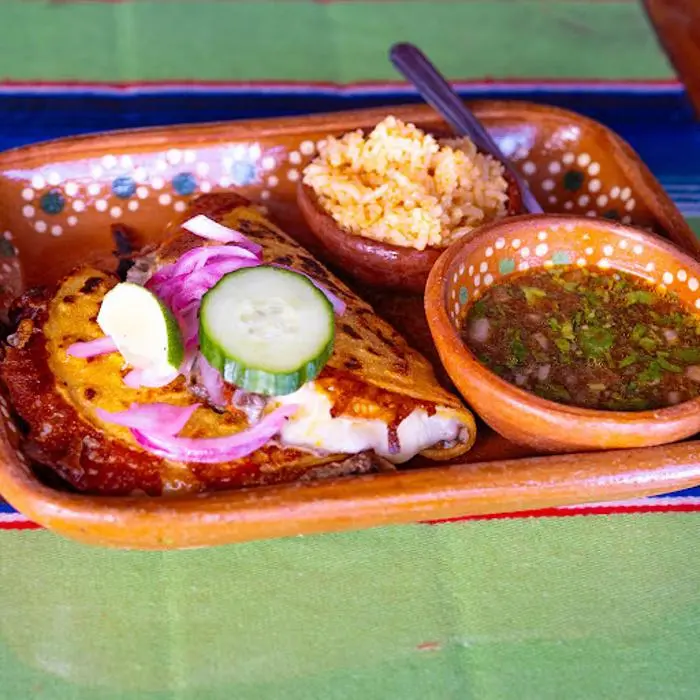 Dream Tacos and Cantina, LLC signature dishes Birria TacosStreet TacosQueso FundidoMargaritas